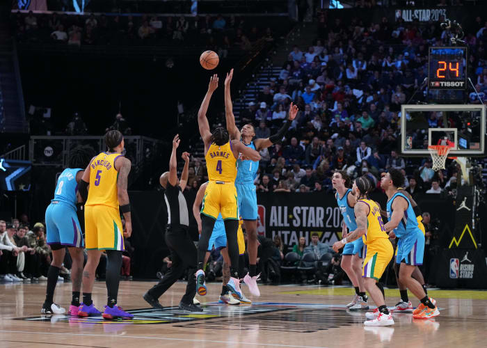 Team Pau forward Scottie Barnes (4) goes up for the opening tip against Team Joakim forward Jabari Smith Jr. (1) in the finals of the 2023 NBA All Star Rising Stars Game at Vivint Arena